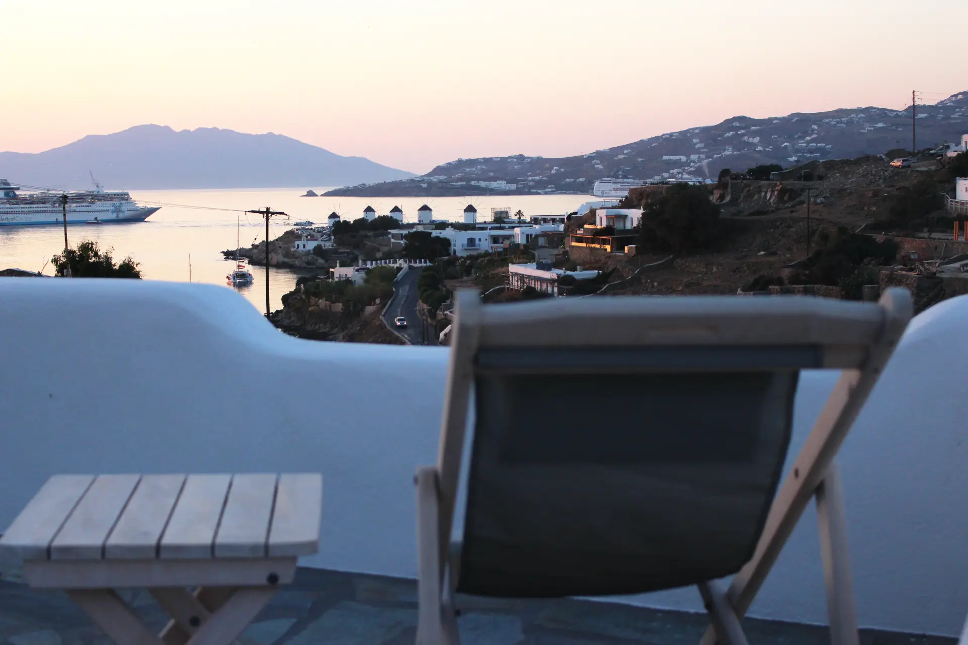 Sunset view over Mykonos Town and the Aegean from a Crystal View Mykonos suite terrace